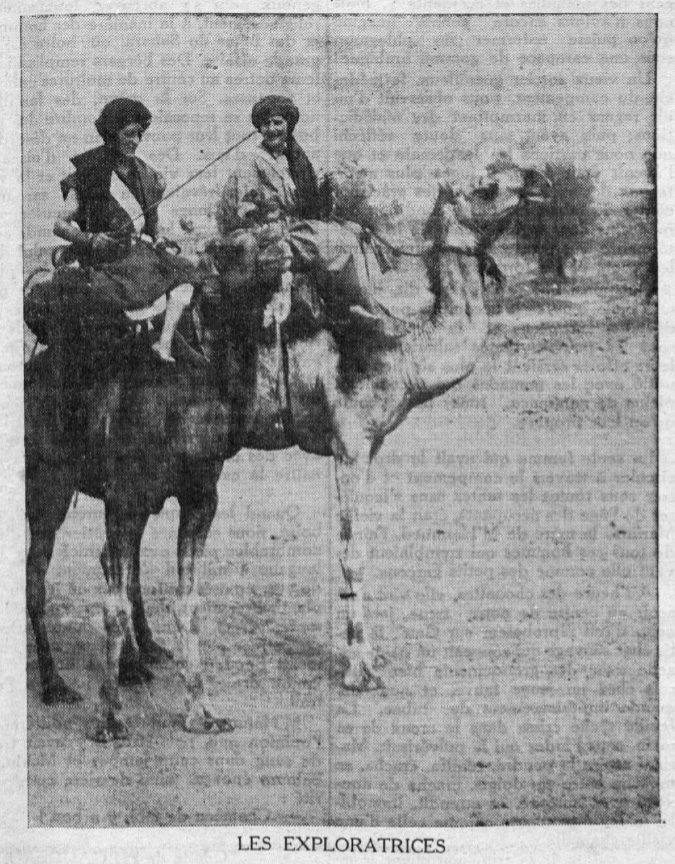 Marion Senones and Odette du Puigaudeau on a camel trek, wearing black cheches on tall dromedaries