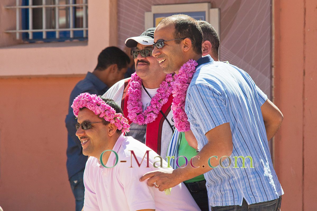 Several men attending the Moussem des Roses are wearing necklaces