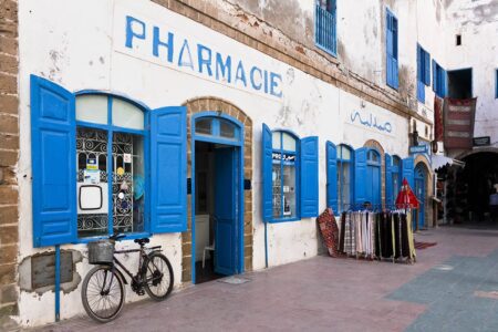 A pharmacy with a blue and white façade