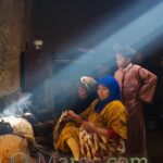 A ray falls on the fireplace in the kitchen during Eid