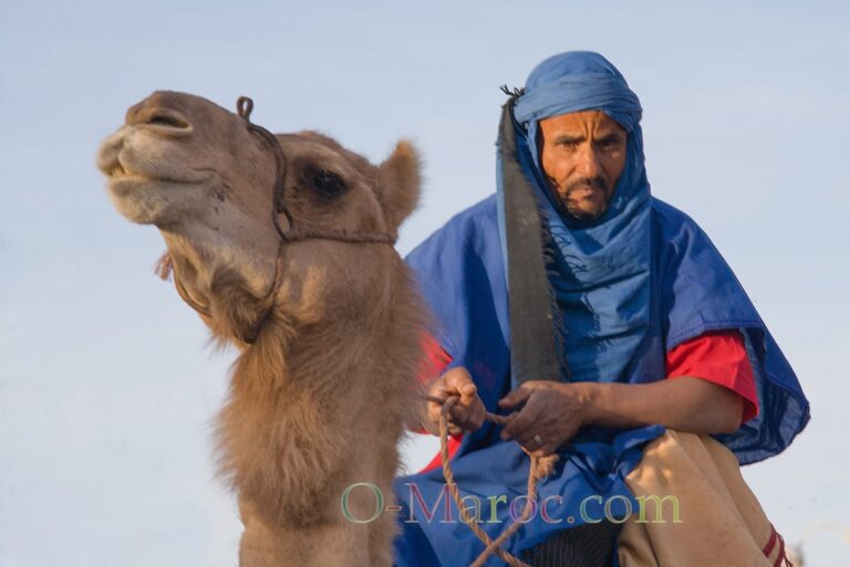 Movie extra in Ouarzazate riding a camel
