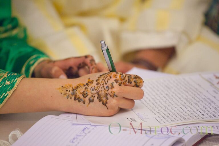 The new bride signing her marriage contract