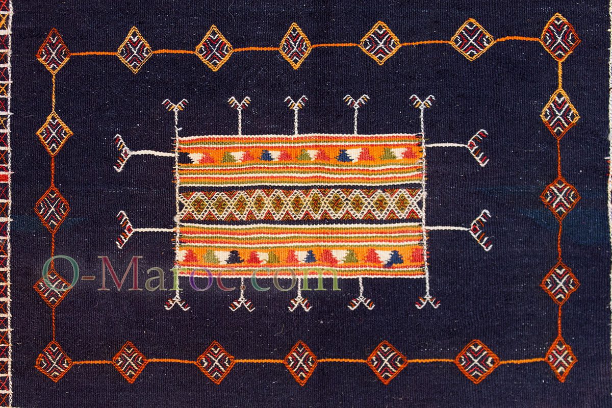 Orange and white patterns on an indigo background