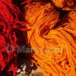 Red and orange wool skeins