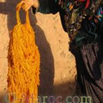Woman dyeing her wool with saffron