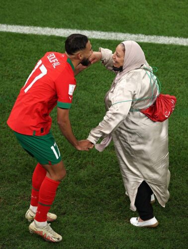 After qualifying for the semi-finals, Bouafal dances with his mother on the field