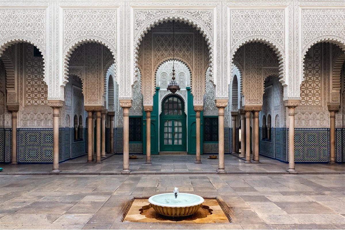 Inner courtyard of the Pasha's Mahkama with its fountain, zellij tiles and richly sculpted stucco arches