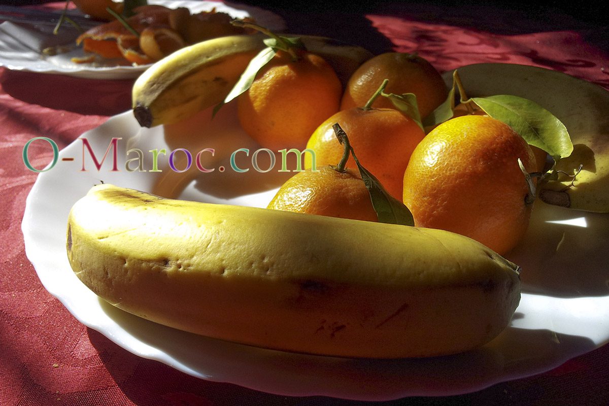 Simple fruit plate with bananas and oranges