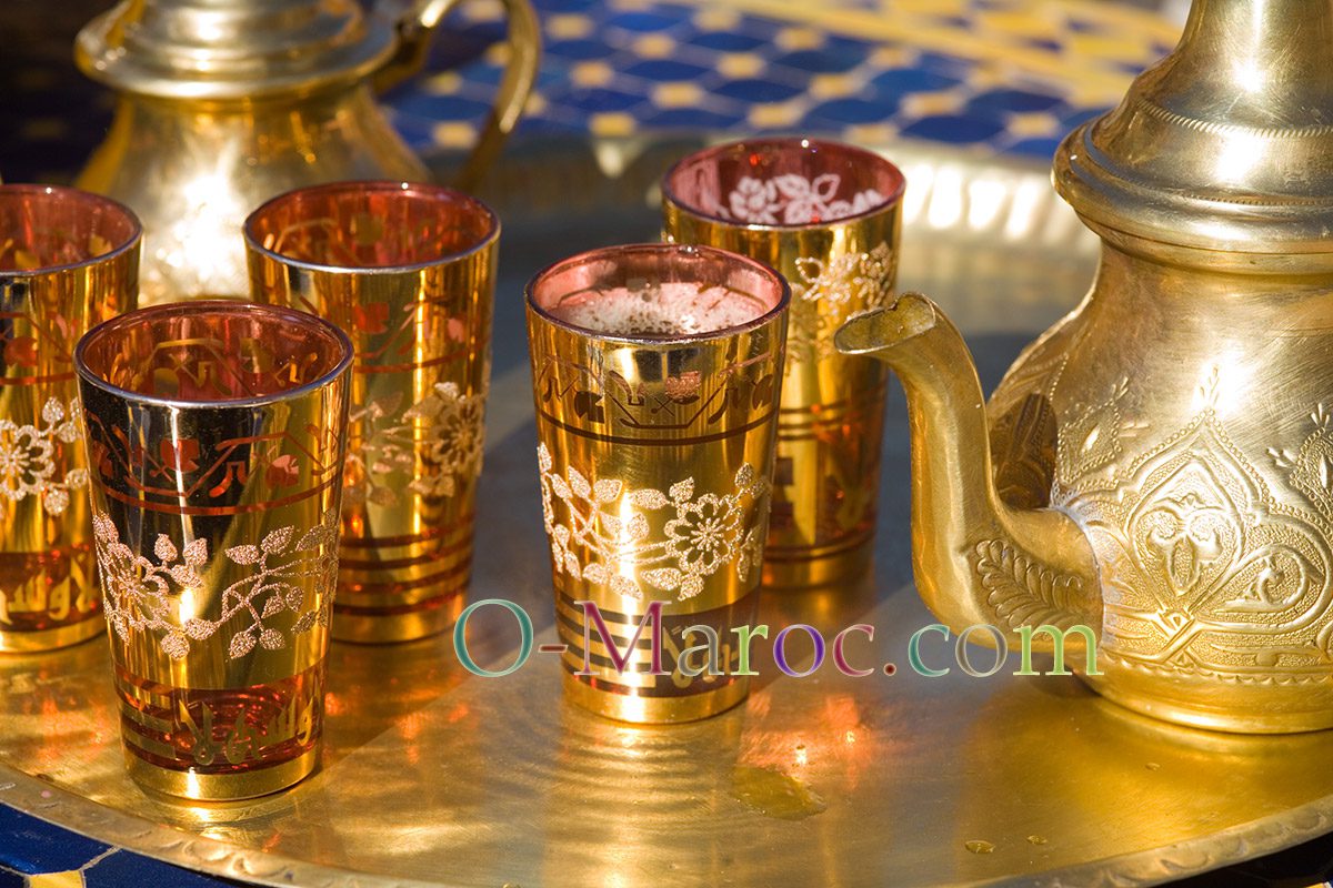 Moroccan green tea in the sun on a copper tray