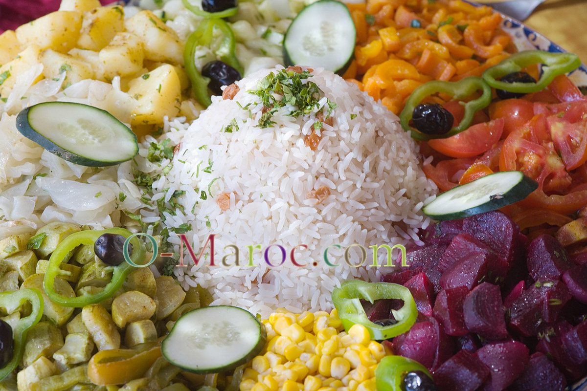 Traditional Moroccan salad with rice, carrots, beetroot, cucumber, olives and corn maïs