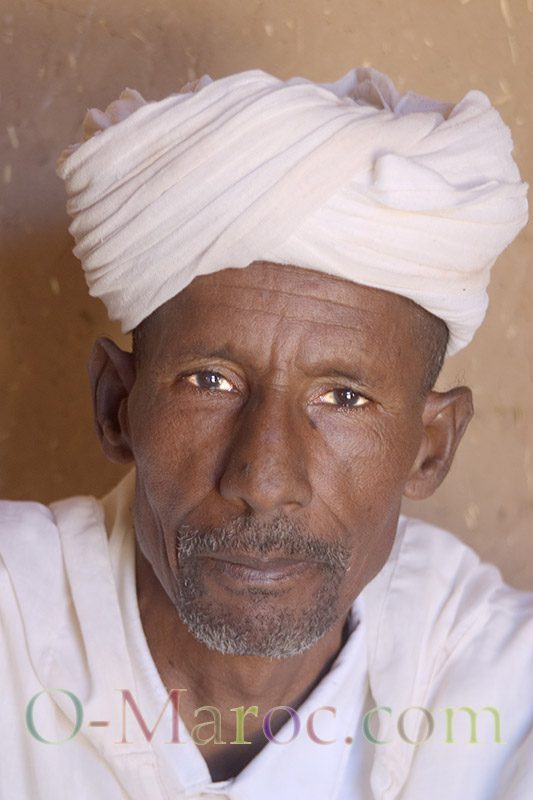 An elderly Moroccan man with a white shesh