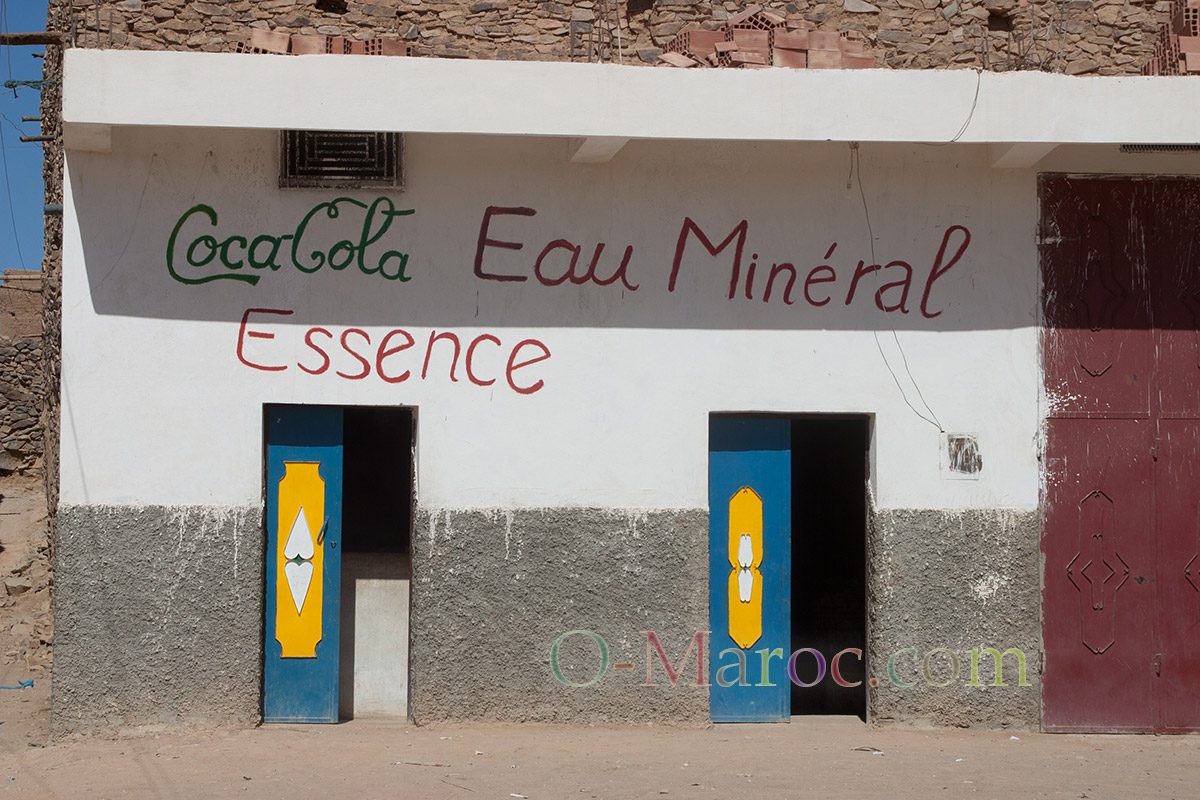 Shop with Coca Cola Eau Mineral (sic) petrol sign