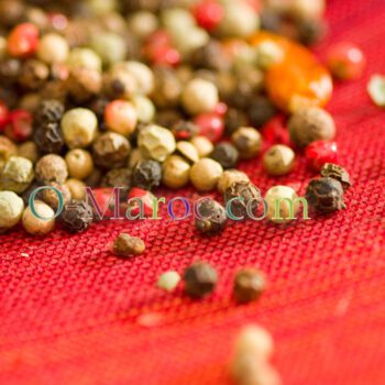 Black, white and red peppers close-up