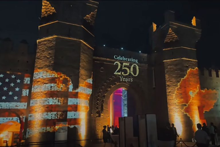 The walls of the Chellah in Rabat illuminated with the Moroccan and American flags and the words “celebrating 250 years”