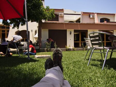 In a garden, someone is working on the lawn