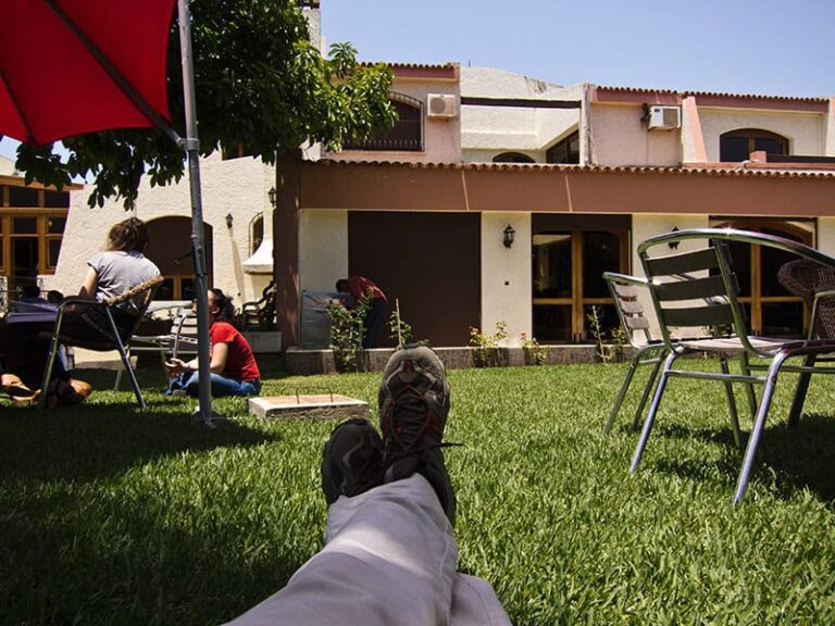 In a garden, someone is working on the lawn